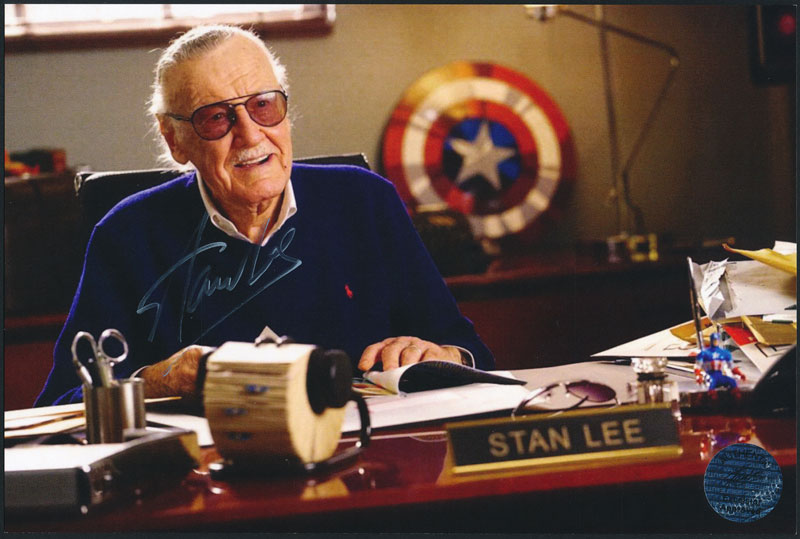 Stan Lee at Desk with Captain America Shield Autographed Photo