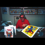 Stan Lee at Desk with Spiderman Poster Autographed Photo